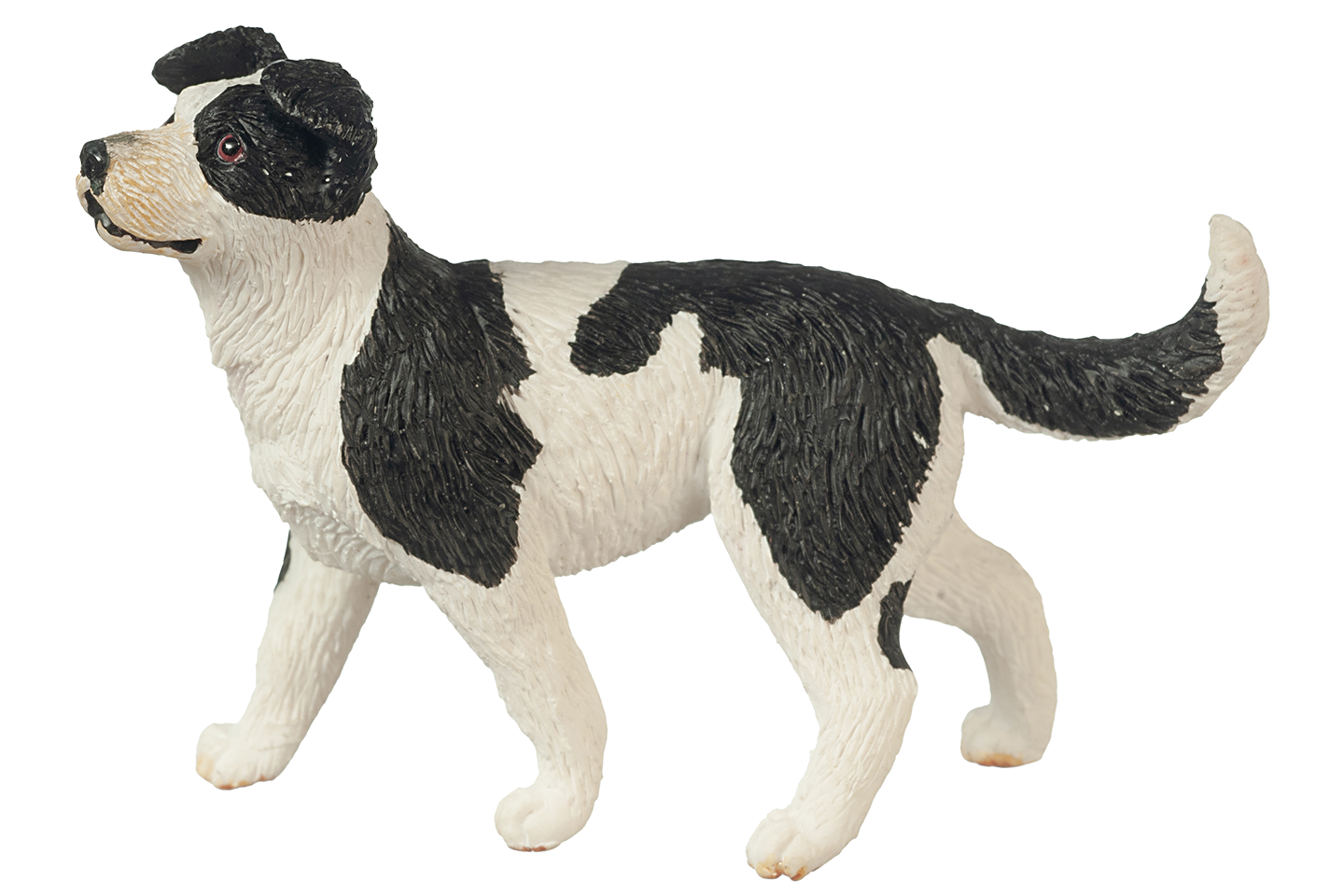 Black and white dog figurine on a white background