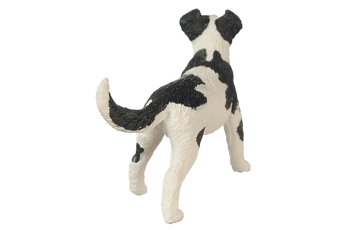 Black and white dog figurine on a white background