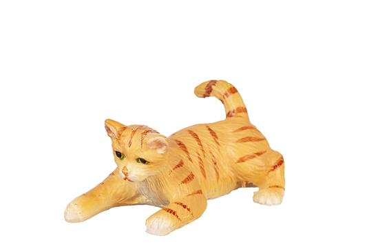 Orange striped cat with green eyes figurine, in a crouched playful position, on a white background