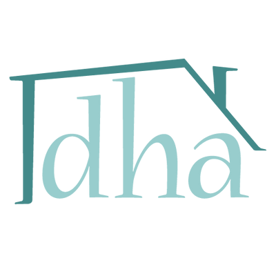 A minimized version of the Dollhouse Alley logo: an abstracted house with a chimney surrounding the letters D H A.